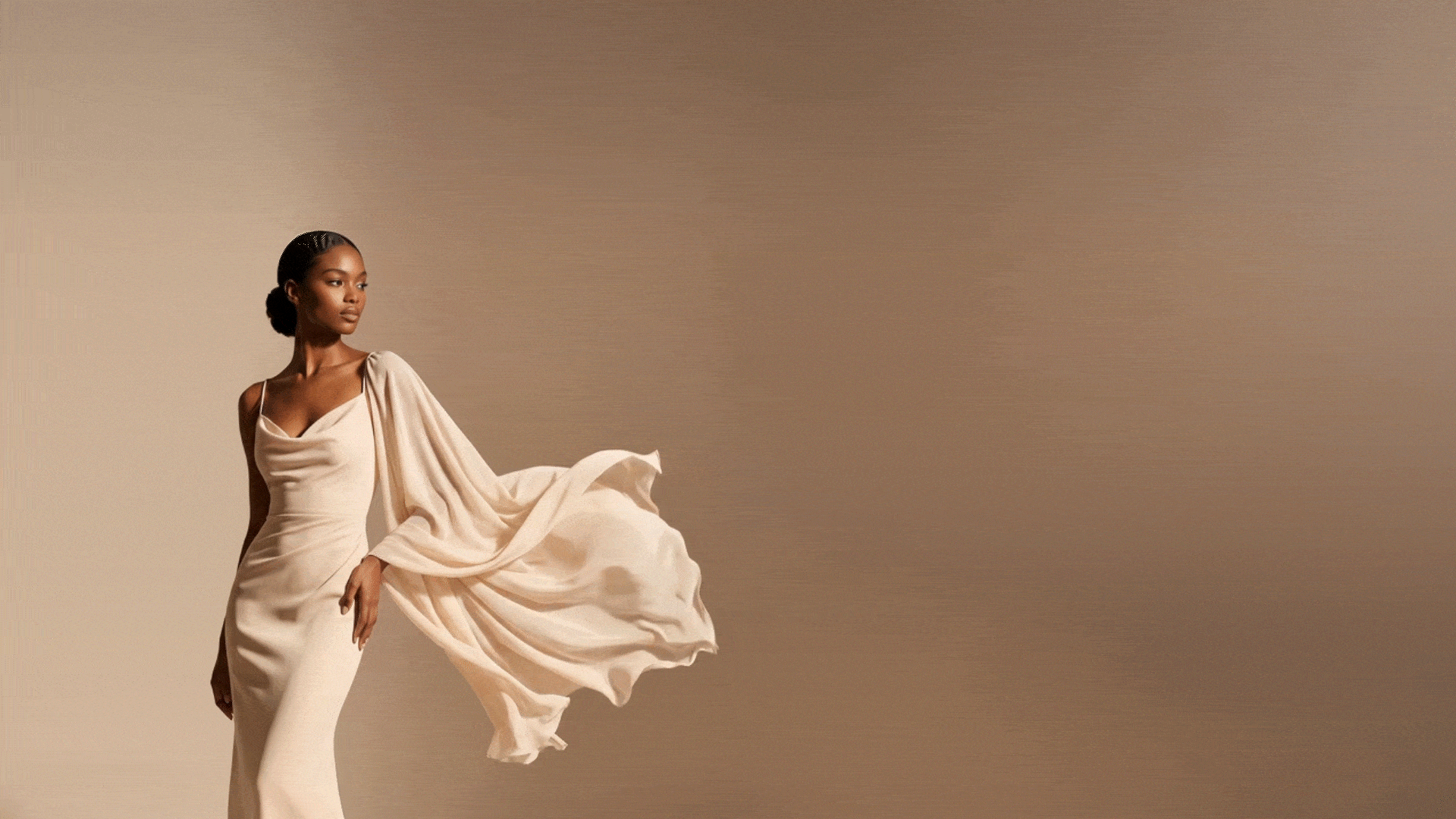 Fashion model in a flowing ivory gown for Artifax AI fashion design platform