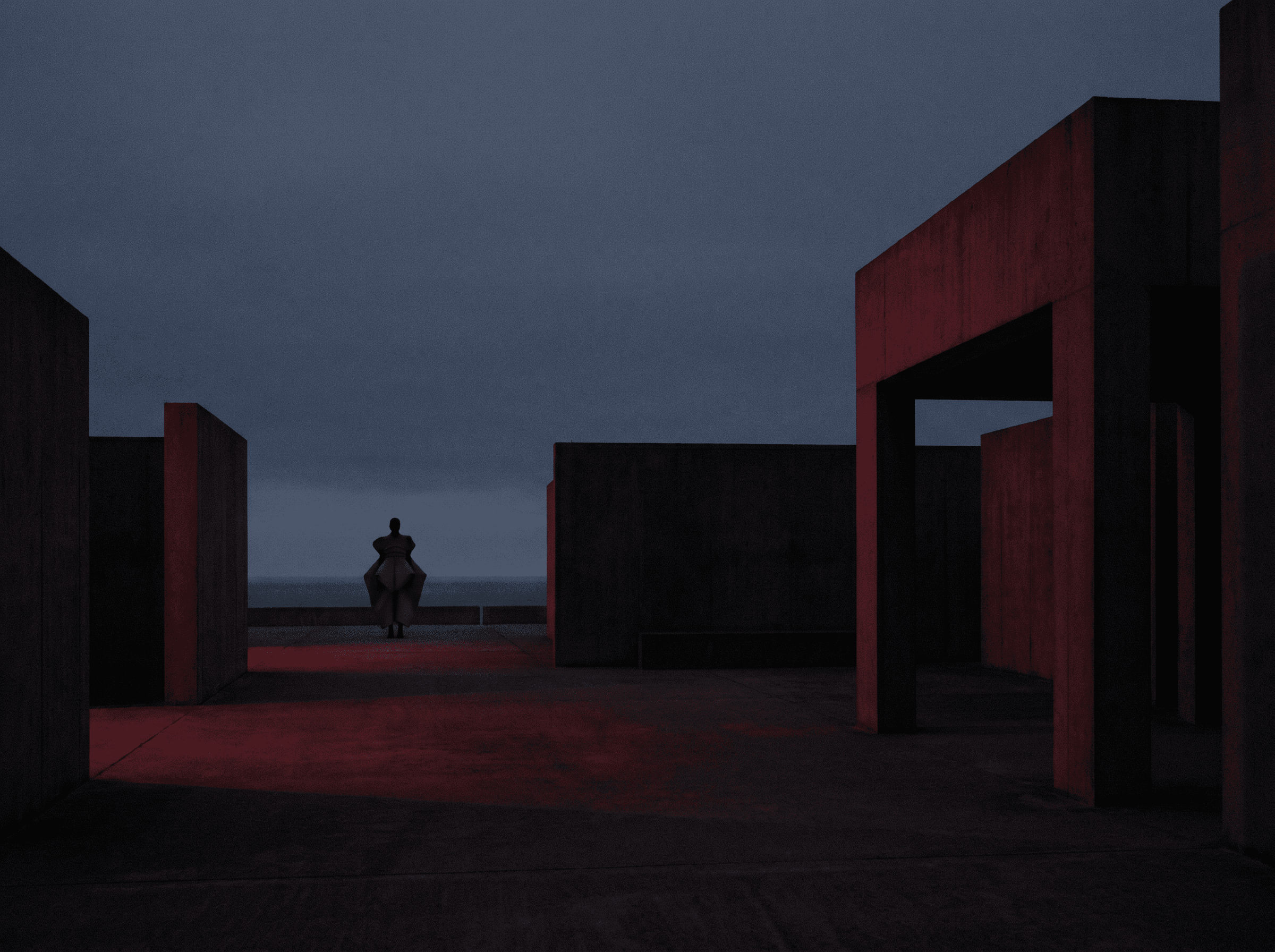 AI-generated fashion campaign image: lone figure in a sculptural pale coat between dark concrete walls at dusk, lit in deep red, sea on the horizon